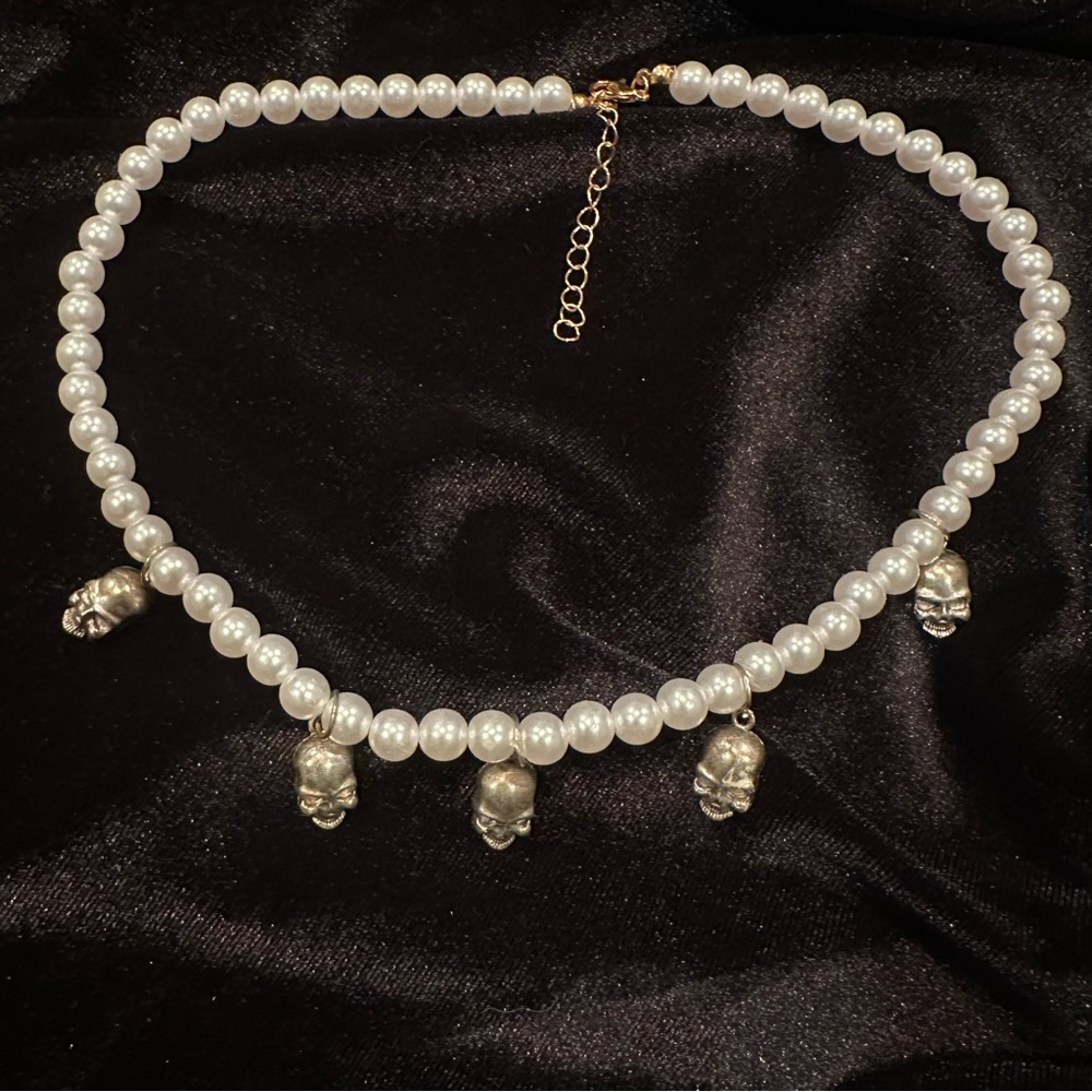 Elegant Goth, Punk faux pearl necklace with skull accents.